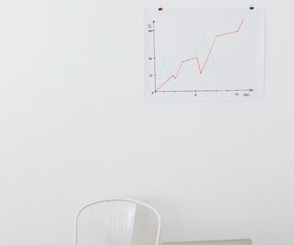A modern and clean office workspace with a person working on a laptop.